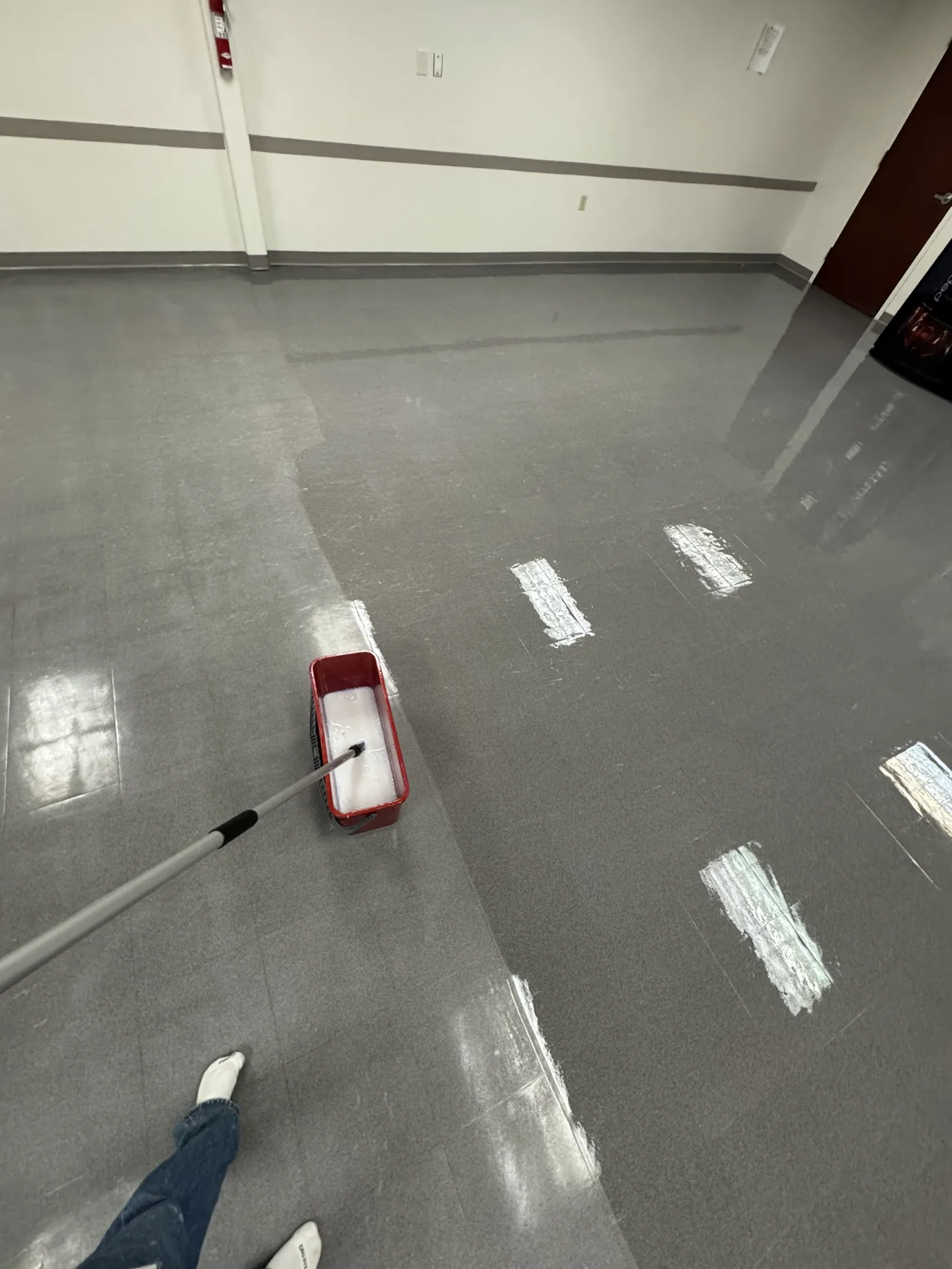 Applying floor finish in a commercial suite, Tulsa OK
