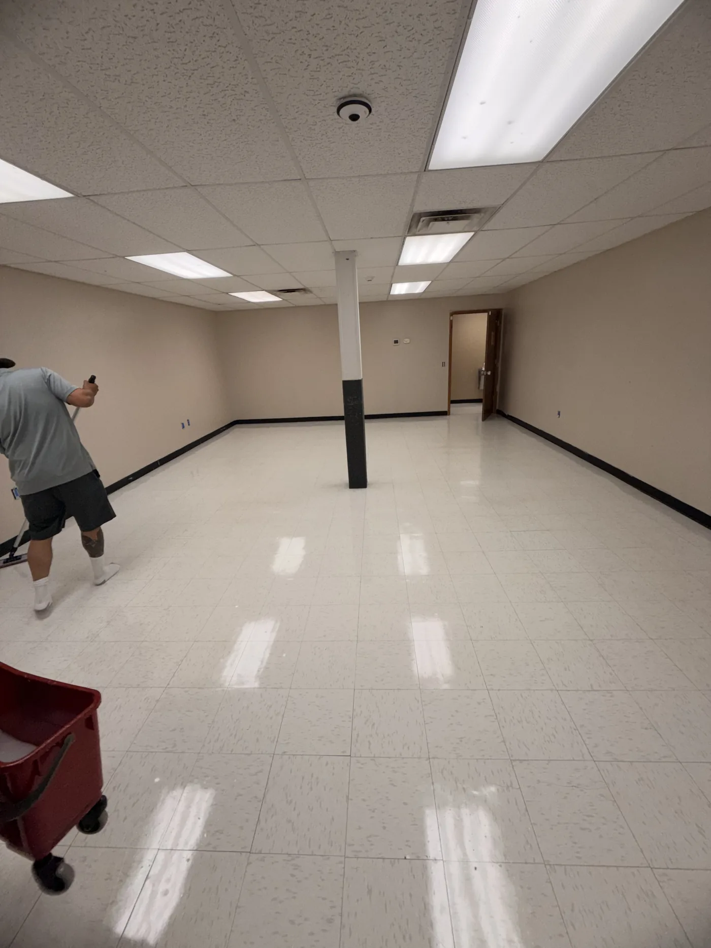 Crew finishing a freshly waxed office floor