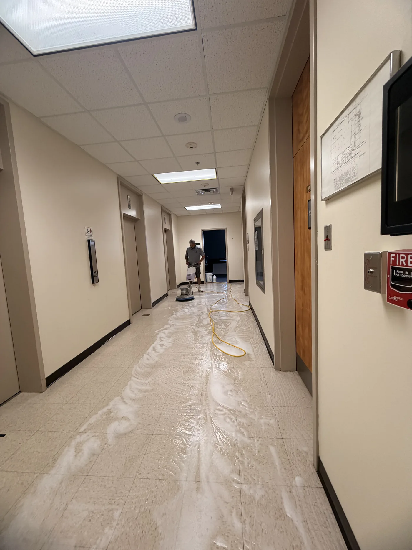 Hallway mid strip-and-wax, finish going down